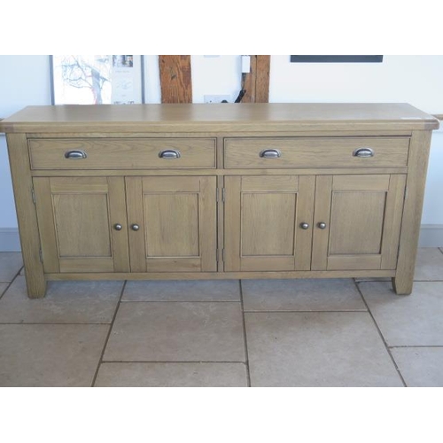 2 - A good quality oak sideboard with two drawers and four cupboard doors, as new RRP £600, 200cm long x... 