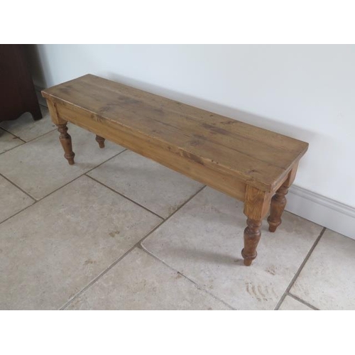 35 - A new rustic pine bench on turned legs, 46cm tall x 129cm x 32cm