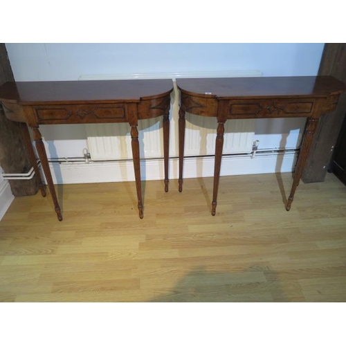 66 - A pair of 19th century style mahogany D shaped side tables each with a blind drawer on turned reeded... 