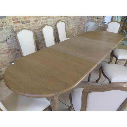 9 - A Bramblecrest oak dining table with two leaves, extends from 200cm to 300cm long x 100cm wide with ... 