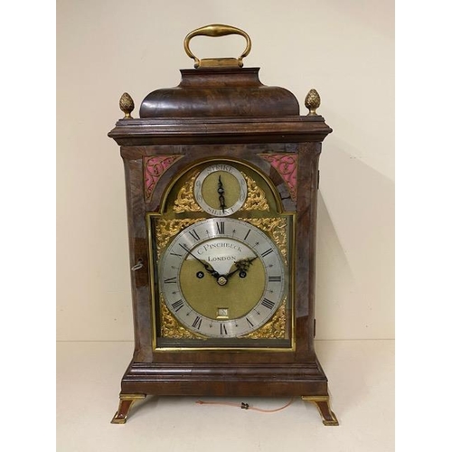 A good quality 18th century and later walnut and brass mounted striking bracket clock . The brass and silvered dial having  calendar and strike silent signed C Pinchbeck London, with a twin fusee movement and verge escapement with repeat, the finely engraved back plate measuring 18cm x 12.5cm, case height with handle up 51cm x 29cm wide x 31cm deep at base, in running order and case in generally good condition, some fading to case and minor veneer losses, clock repairers label to door so the clock has been recently maintained