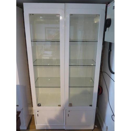 21A - A pair of good quality shop display cabinets with electric lighting and slam shut locks, each 199cm ... 