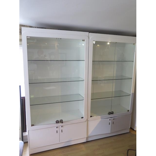 21B - A pair of good quality shop display cabinets with electric lighting and slam shut locks, each 199cm ... 