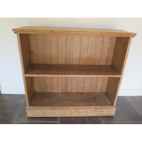 33 - A Victorian stripped pine open fixed shelf bookcase, 119cm tall x 127cm x 37cm
