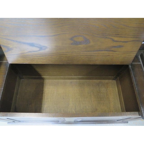 40 - An oak Monks bench with lift up seat, 95cm wide x 42cm deep
