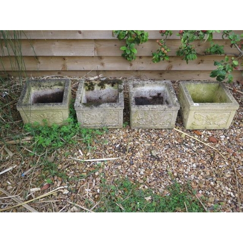 30 - A set of four stone effect square planters, 23cm tall x 33cm