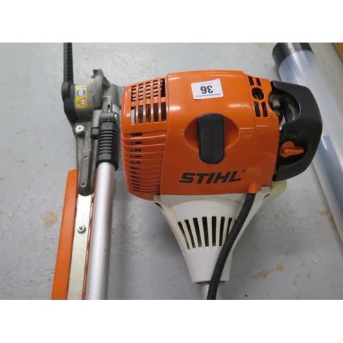 36 - A Stihl K100R four mix petrol multi-tool strimmer, hedge cutter with extension pole and three manual... 