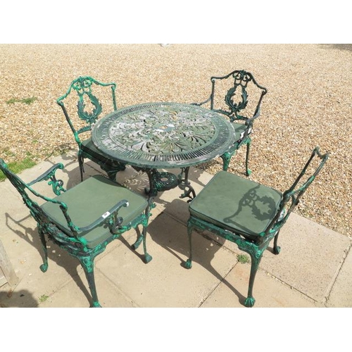 40 - An aluminium garden table and four chairs, table 80cm diameter