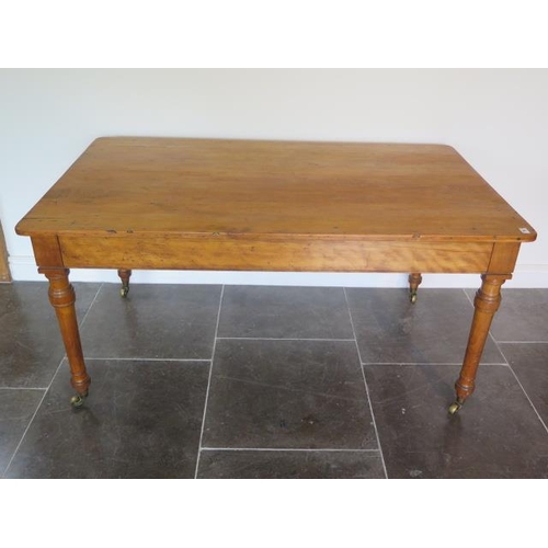 65 - A 19th century satinwood table with two long drawers both stamped Holland and Sons with a later pine... 