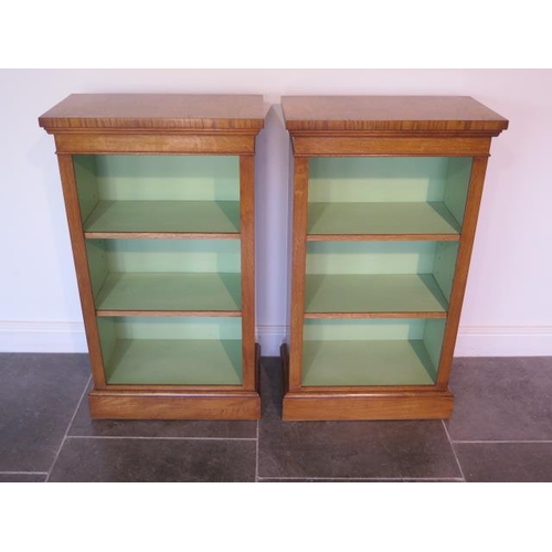 7 - A pair of new burr oak bookcases with adjustable shelves and a painted interior made by a local craf... 
