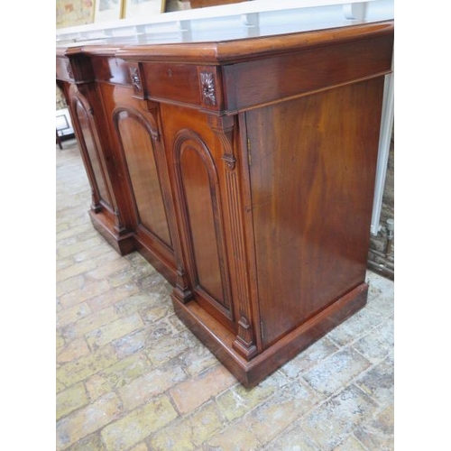70 - A good quality mahogany breakfront sideboard with two frieze drawers and three cupboard doors enclos... 
