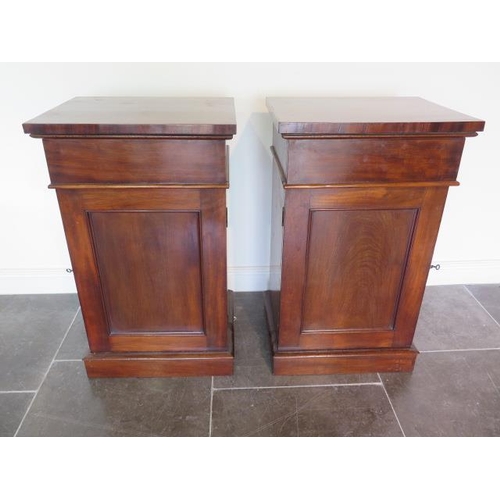 72 - Two mahogany pedestals each with a blind drawer above a cupboard door, 93cm tall x 54cmn x 43cm, in ... 