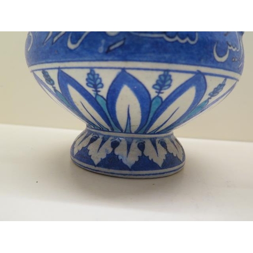 290 - A rare blue and white Iznik Turkish pottery tri-handle mosque lamp with calligraphy, scroll and leaf... 