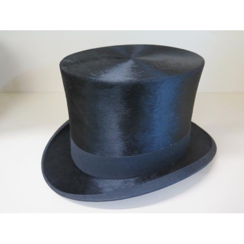 309 - A Christys of London black silk top hat with Peter Robinson box, size approx 7 1/2, measures 16cm ta... 