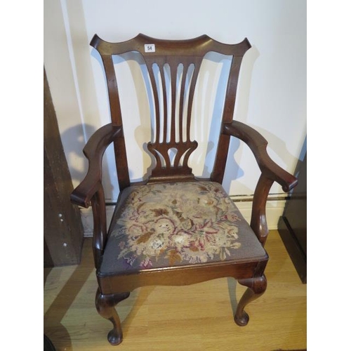54 - A Georgian American walnut open armchair with a vase shaped splat and scroll arms on cabriole shaped... 