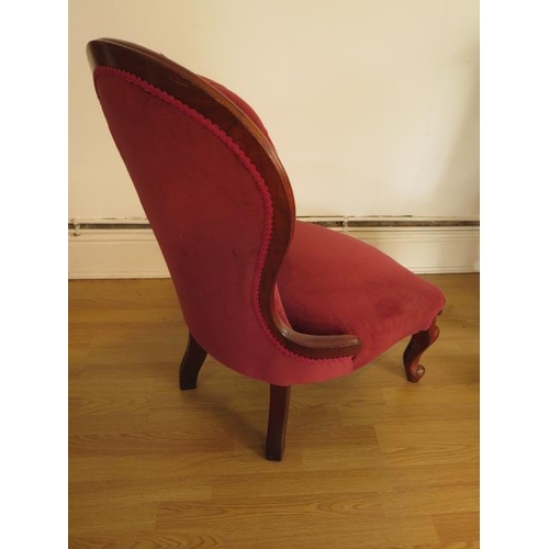 57 - A Victorian button back fireside chair, 89cm tall, seat height 33cm