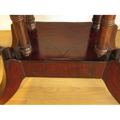 58 - A 19th century mahogany foldover card table on four pillar support and splayed legs on brass hairy c... 