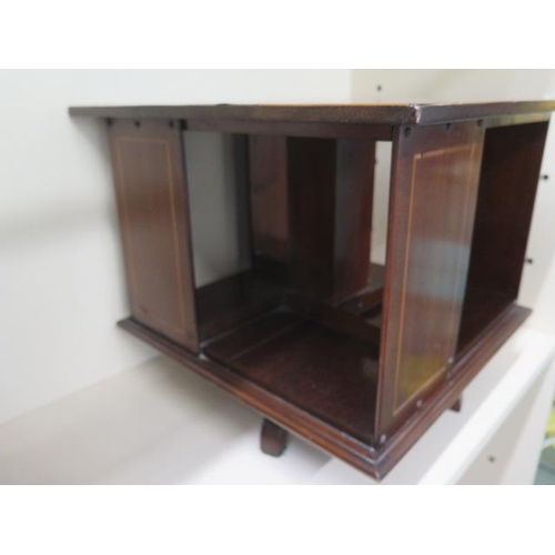 60 - An Edwardian mahogany  inlaid table top revolving bookshelf, 33cm tall x 39cm x 39cm, in generally g... 