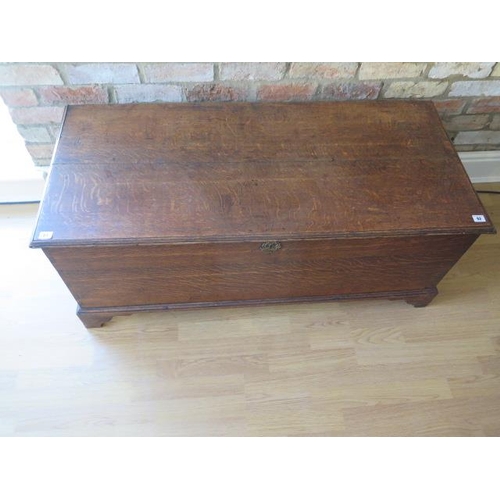 61 - A 19th century oak coffer storage box with an internal candle box with a well figured top, 51cm tall... 