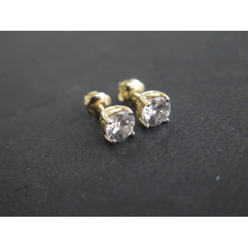 618 - A pair of 14ct yellow gold diamond earrings total estimated 1.16ct, marked 14K, with screw stud back... 