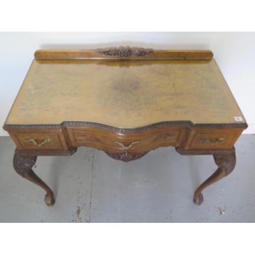 62 - A walnut three drawer serpentine fronted table on acanthus carved cabriole legs, 90cm tall x 114cm x... 