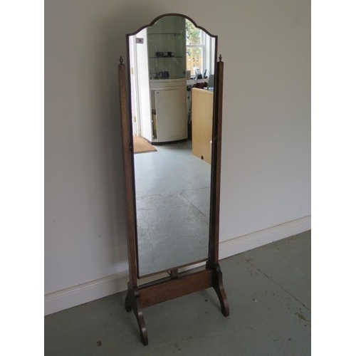 76 - A 1930s oak cheval mirror in good polished condition, 152cm x 49cm