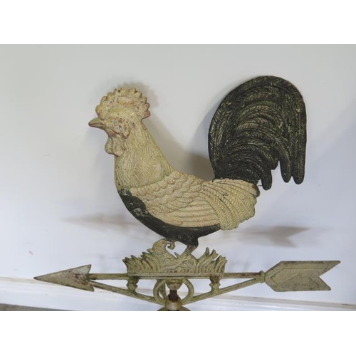 8 - A cast iron weather vane with cockerel to spire, 74cm tall
