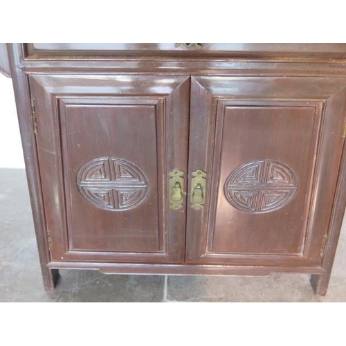 82 - An Oriental hardwood side cabinet, 79cm tall x 65cm x 38cm