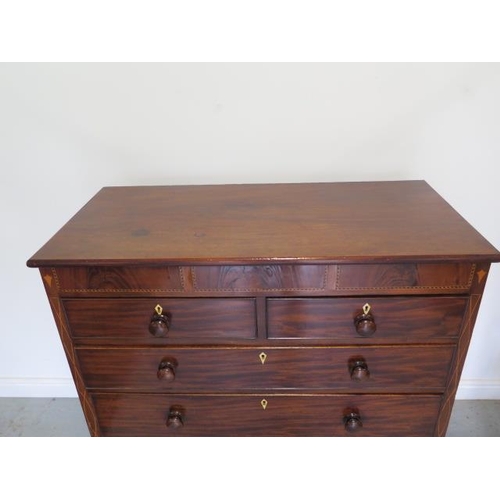 87 - A 19th century mahogany five drawer chest with an inlaid frieze on bracket feet united by a shaped a... 