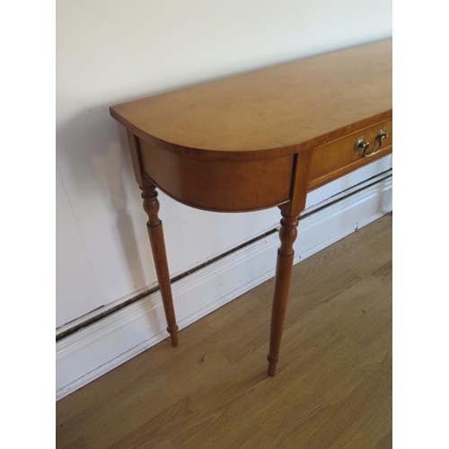 19 - A maple D shaped hall side table with two drawers on turned legs made by a local craftsman to a high... 