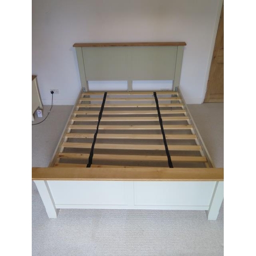 2 - A five foot double slatted bedstead, the headboard 111cm tall
