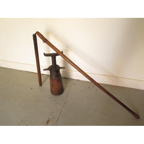303 - A vintage flail, total length 194cm, and a vintage wagon jack 51cm tall