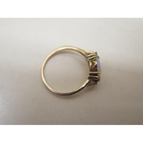 624 - A yellow metal ladies dress ring incorporating a single cabochon cut pale opal, size approx 10mm x 8... 