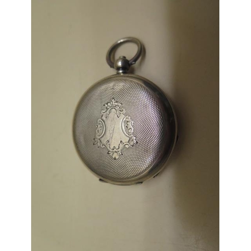 809 - A silver cased Dent & Sons hunter pocket watch, 5cm case, in running order, some wear / dents to cas... 