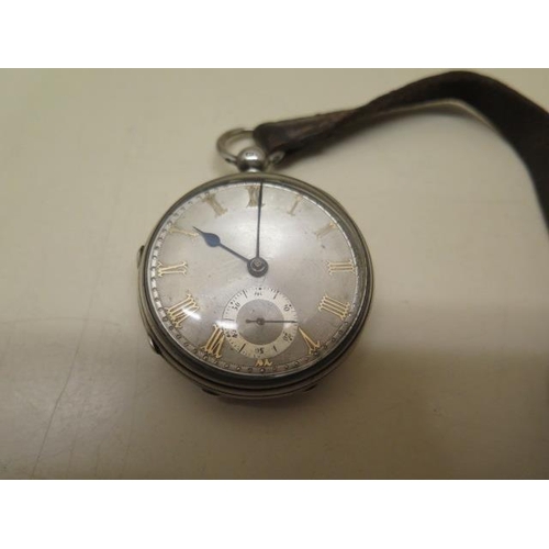 811 - A silver pocket watch with silver dial, 4.6cm case, running order, some scratches to dial, with key