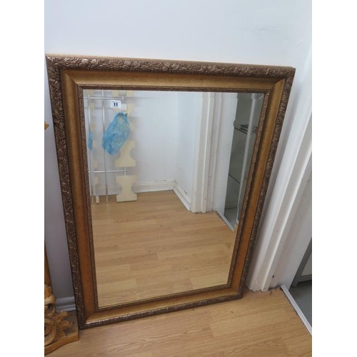 11 - A modern gilt framed wall mirror, 108cm x 78cm
