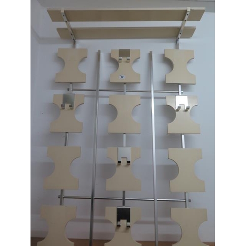 12 - An Art Deco style wall mounted coat rack with adjustable hooks, 110cm x 74cm