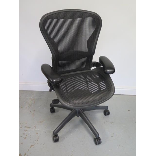 22 - A Herman Miller Aeron office chair with lumbar support in black in good condition