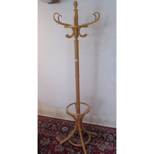 25 - A blond bentwood coat / hat stand, 184cm tall