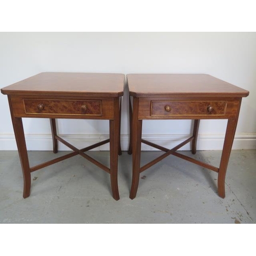 28 - A pair of burr wood veneer lamp tables each with a drawer on splayed legs united by cross stretchers... 