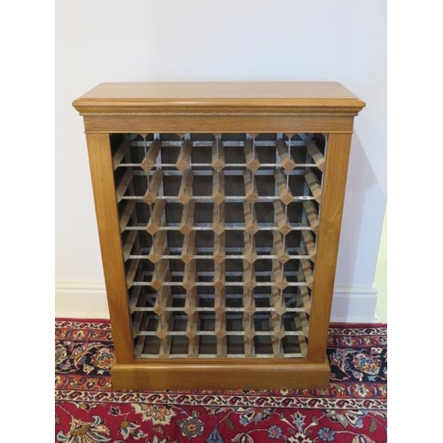 36 - An oak 48 bottle wine rack made by a local craftsman to a high standard, 98cm tall x 74cm x 28cm