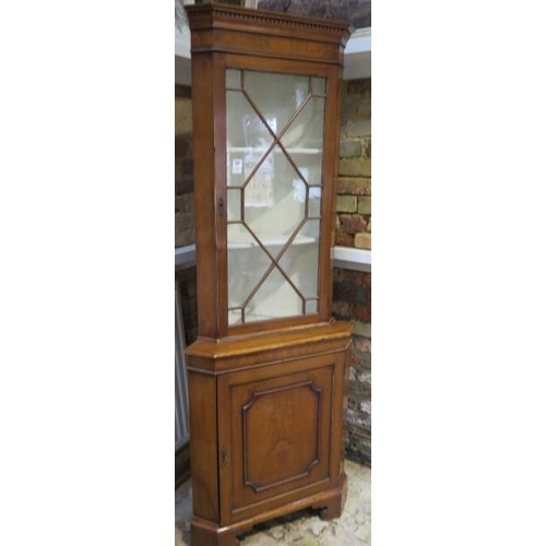 53 - A Georgian style walnut corner cupboard with an astragel glazed top with key, 187cm tall x 69cm wide