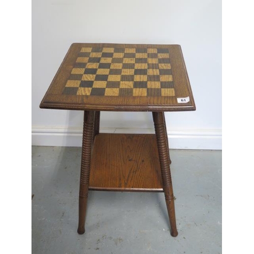 61 - An early 1900s oak chessboard sidetable with an undertier, 62cm tall x 40cm x 40cm