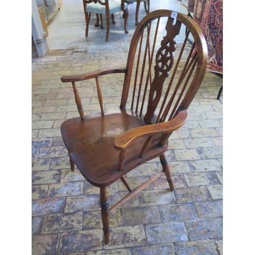 71 - An ash and elm wheelback Windsor armchair, 98cm tall