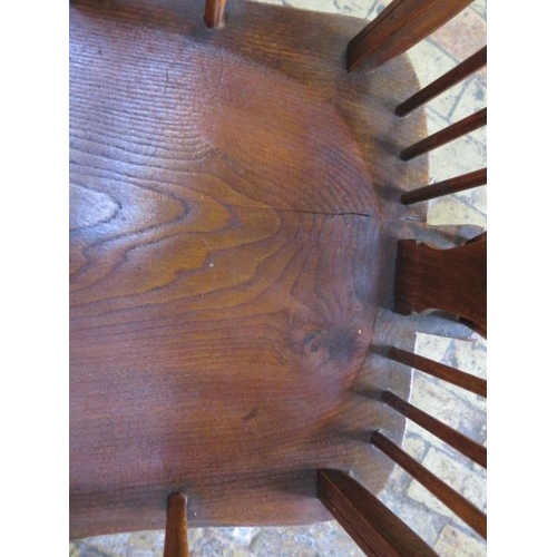 71 - An ash and elm wheelback Windsor armchair, 98cm tall