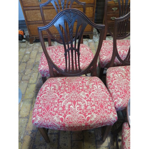 54 - A set of 10 mahogany dining chairs with shield shaped backs overstuffed seats on square tapering leg... 