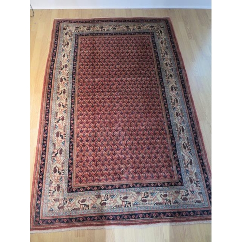 201 - A hand knotted woollen Araak rug, 2.10m x 1.32m