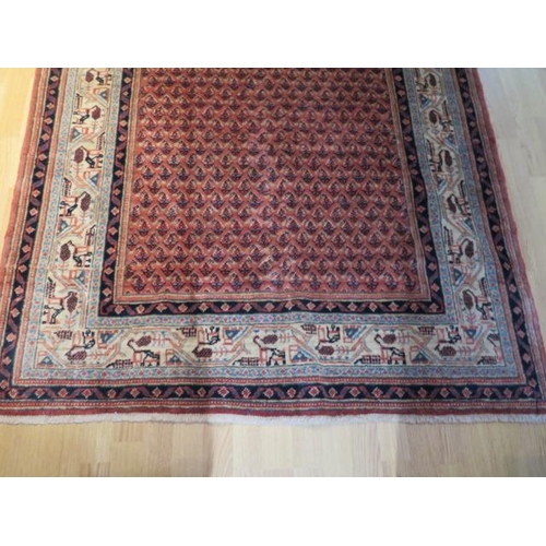 201 - A hand knotted woollen Araak rug, 2.10m x 1.32m