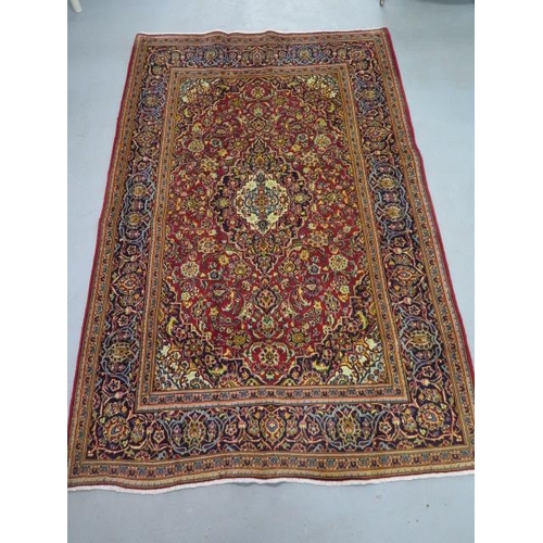 203 - A hand knotted woollen Kashan rug, 2m x                 1.35m