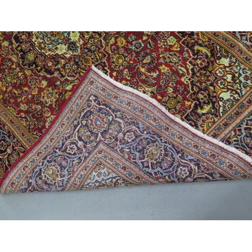 203 - A hand knotted woollen Kashan rug, 2m x                 1.35m